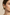 Close-up of model wearing smaller brushed gold crescent stud earring